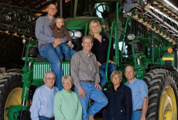 Larson family on tractor in Illinios