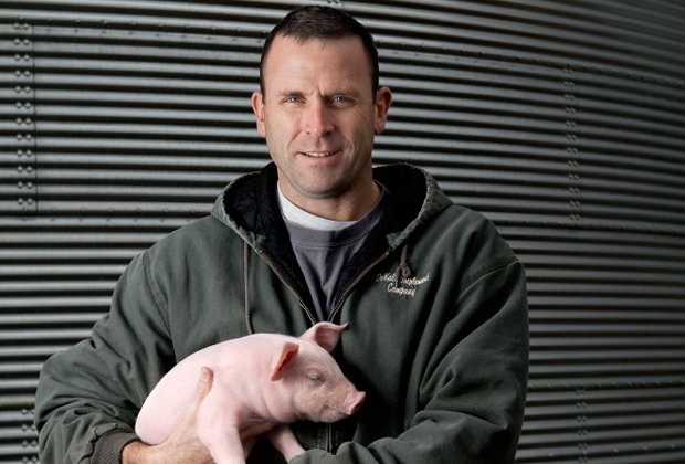 Chris Gould with piglet