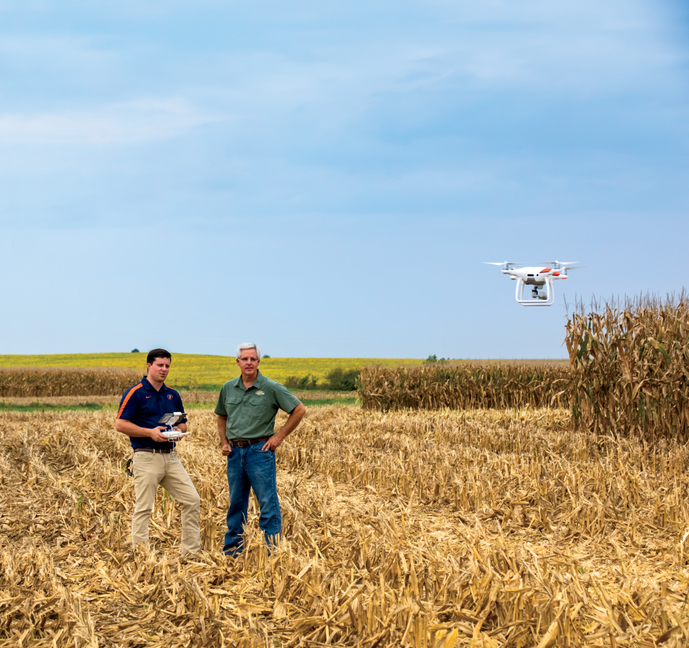 drone and farmers in Illinois cornfield