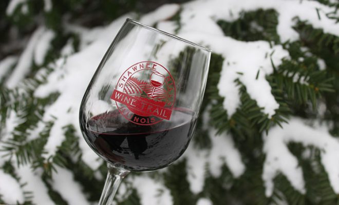 Shawnee Hills Wine Trail wine glass with snowy tree branch in background