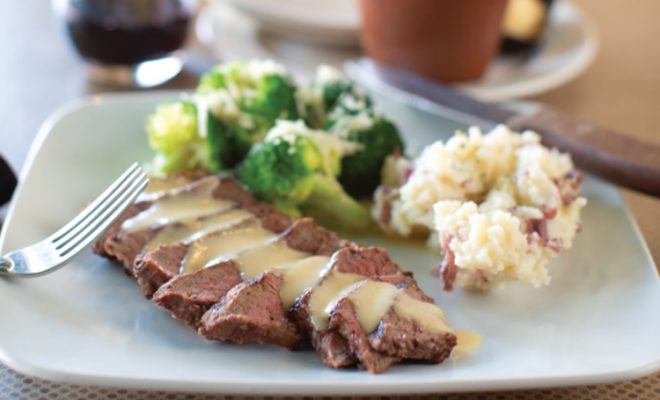 The Beef Medallion with Cognac Sauce is served with Steamed Broccoli, Smashed Red Potatoes and the Signature Flower Pot Bread at the Gallatin Street Grille in Vandalia, Illinois.