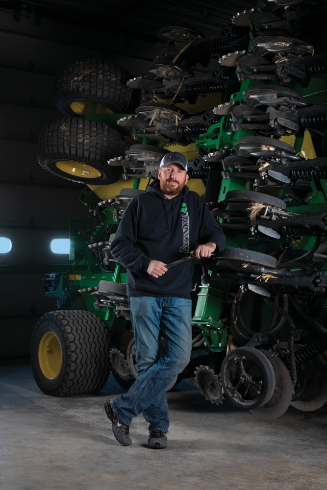 Matt Boucher next to the air seeder