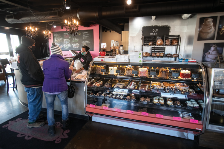 Visitors shop for baked goods at Le Bakery on the Sqaure