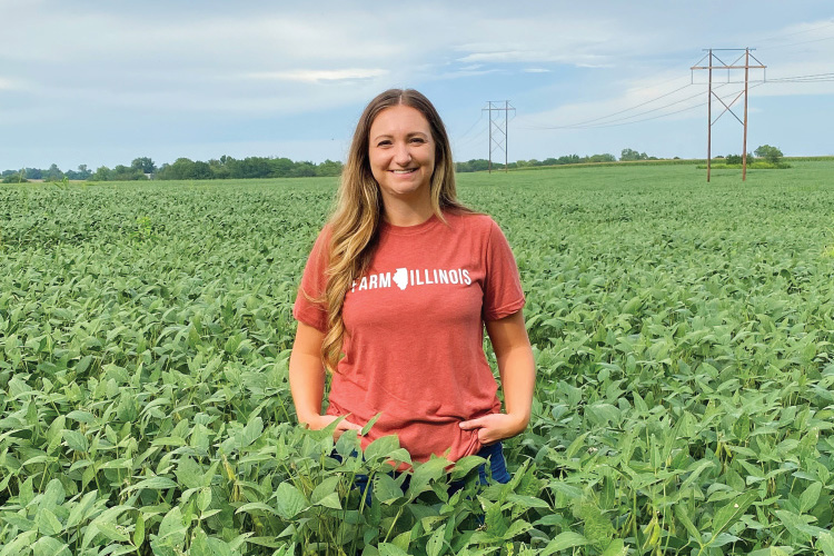Ida Hand stands in a soybean field at her family farm