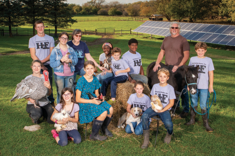 Anita and Larry Miller surrounded by children, grandchildren and interns at their Hephzibah Farms