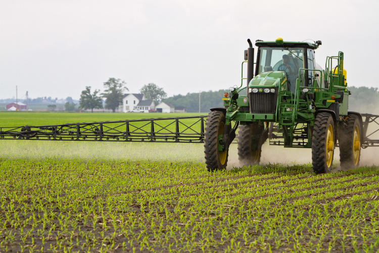 Tractor spraying crops 