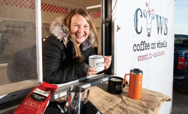 Katlyn Sanden leans out the window of her mobile coffee stand, Coffee on Wheels