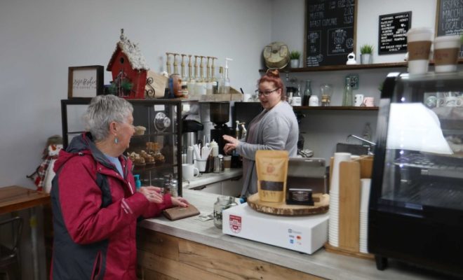 Kristy Dauck serves a customer at Local Cup and Cake