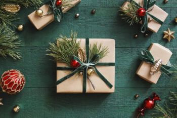 High angle view of Christmas present wrapped in kraft paper; Illinois gift guide