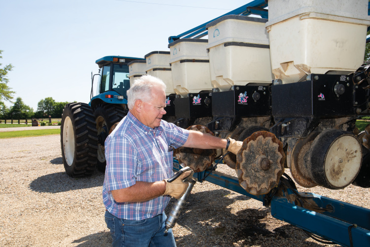 Dennis Green get his equipment ready for planting season