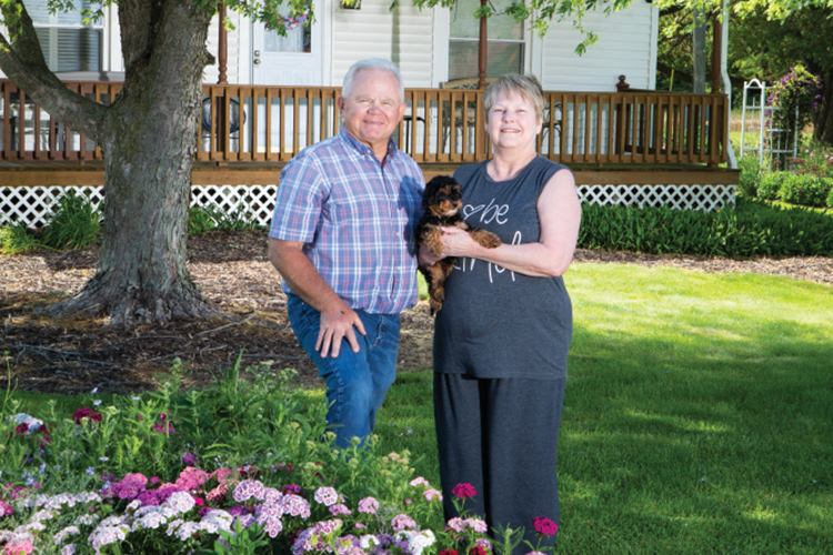 Dennis Green with his wife, Debbie, and their puppy