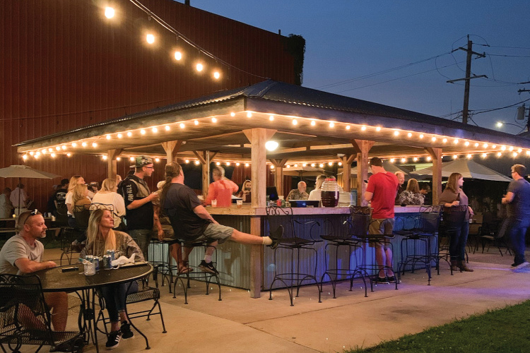 People at the outdoor beer garden during First Fridays