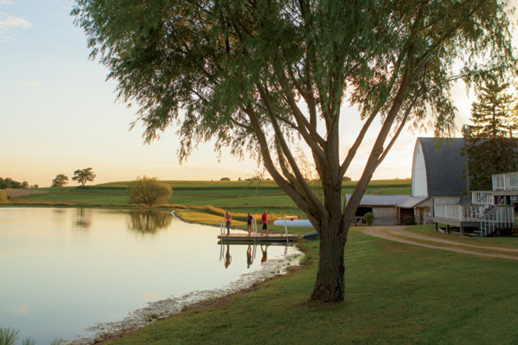 Kids on a dock at a fishing pond