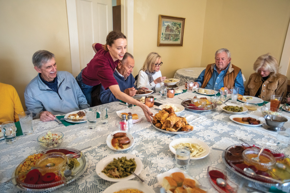 Waitress delivering a meal to a table at Wittmond Hotel Restaurant