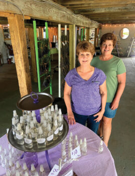 Kim Hansen and Kris Straub in their farm store with some lavender products