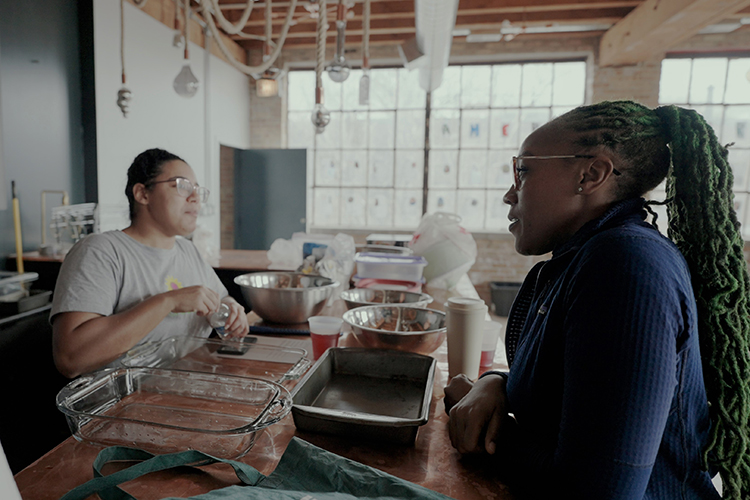 Selma Sims talks with a volunteer