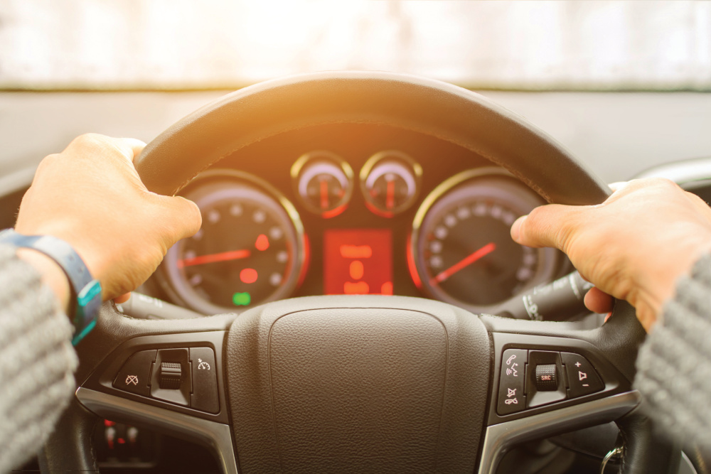 Hands on a steering wheel