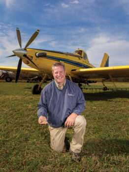 Joe Curless with one of his air tractors in the background