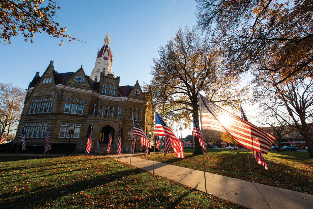 Exterior of the Pike County Courthouse with American Flags lining the walk