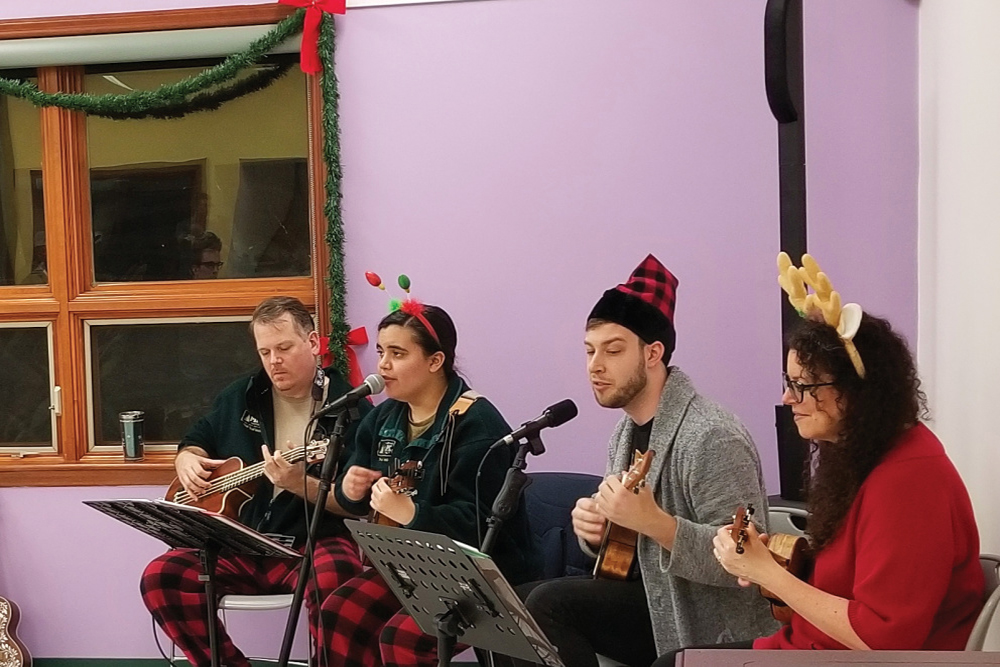 People singing and playing instruments at the Winter Solstice event 