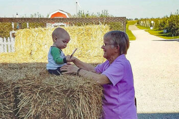 Mary Lynn McArtor, owner and one of Jonamac Orchard’s founders, is able to make memories with her great-granddaughter and fourth generation, Amy Spychal, on the farm.