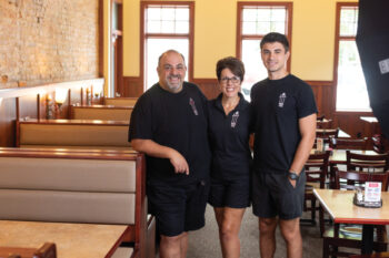 Gaspare and Jill Cucinella with their son, Giuseppe inside the restaurant 