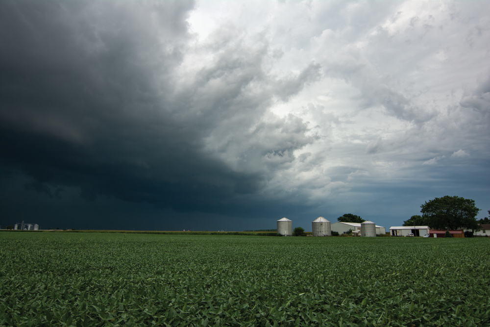 Storm clouds over a farm