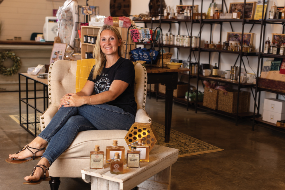 Amber Rutledge sitting in the store at Wild Harvest Honey Farm