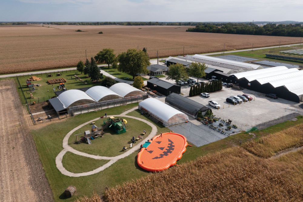 Drone view of Benoit Greenhouses that shows the pumpkin, greenhouses, corn maze and more