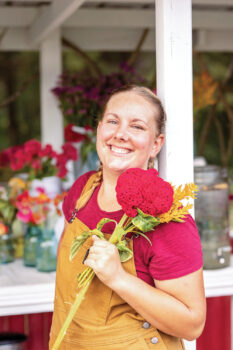 Pearl Carpenter holding flowers