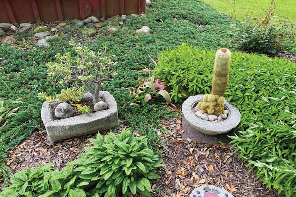 Hypertufa flower pots in a garden 