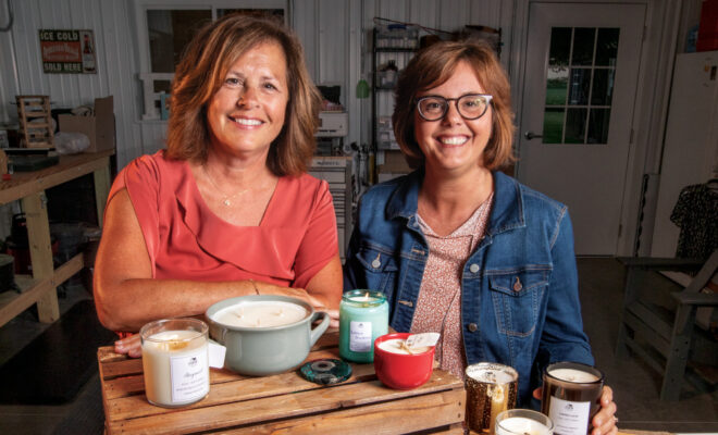 Alice Long and Amy Manahan with some of their items they sell and make at Farm to Wick, a Made in Illinois candle company