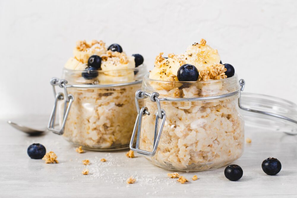 A jar of oats with blueberries and bananas