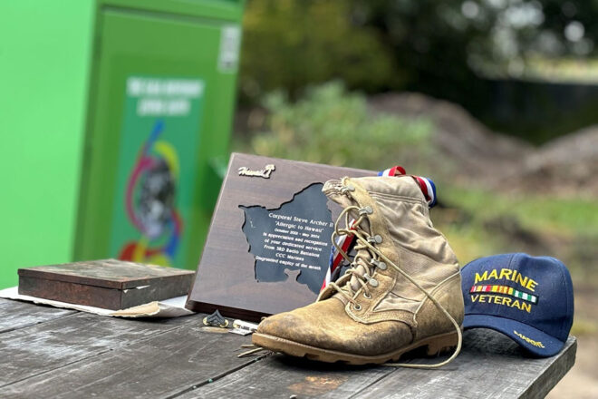 Steve Archer displays some of his memorabilia from his service in the Marines.