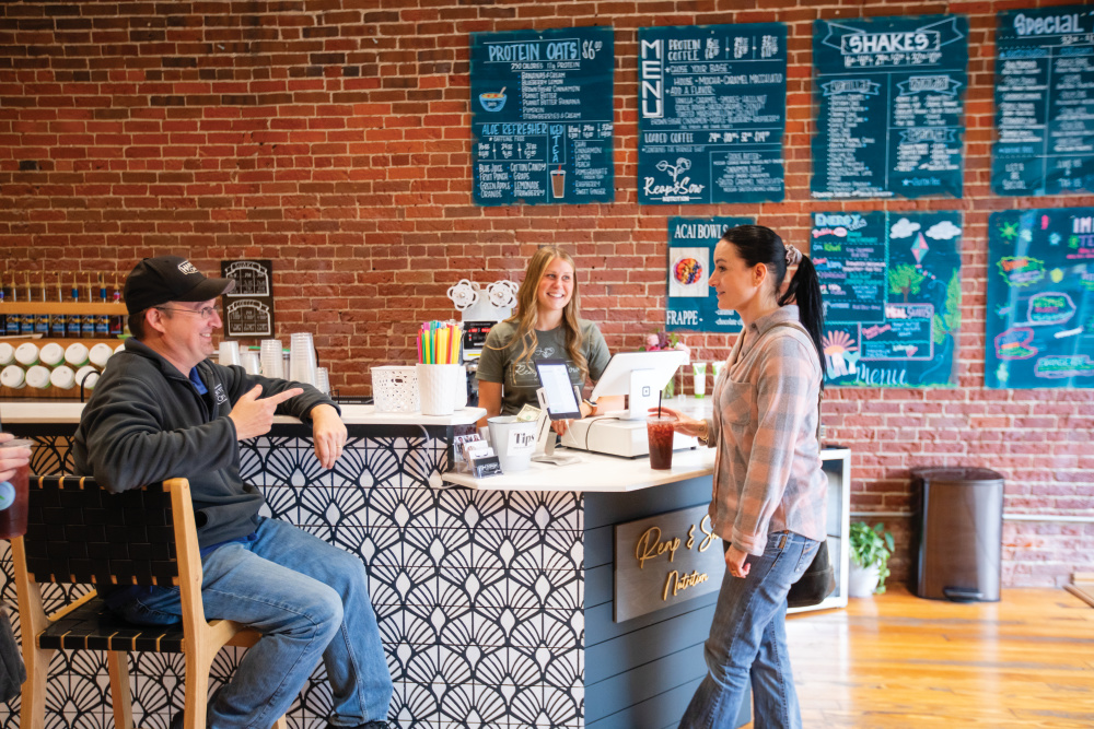 Nichole Mills helps customers at Reap & Sow Nutrition