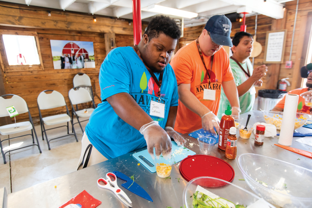 Navarro Farm workers making elote dip