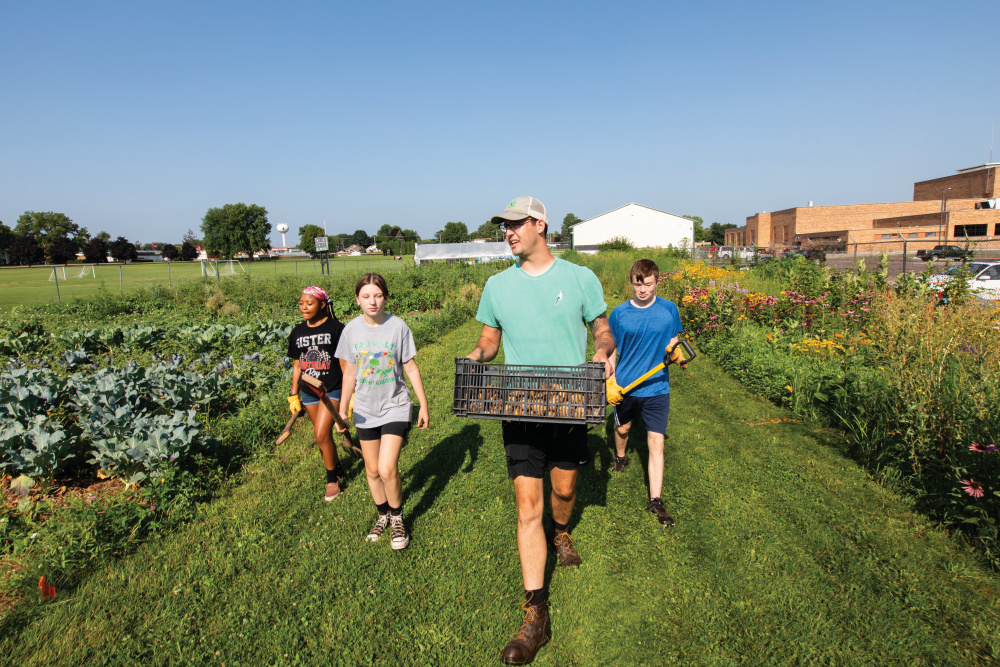Ben Skipor with some of his students in the Freeport Student Garden