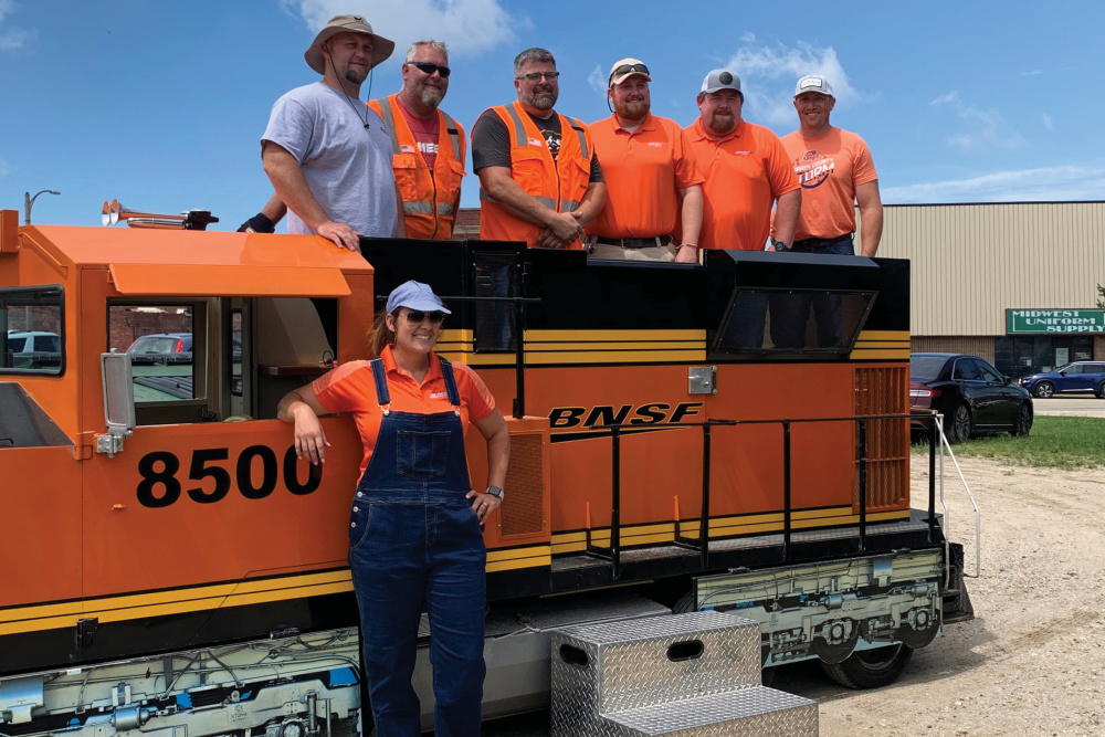 Galesburg Railroad Days workers pose with a train on event day