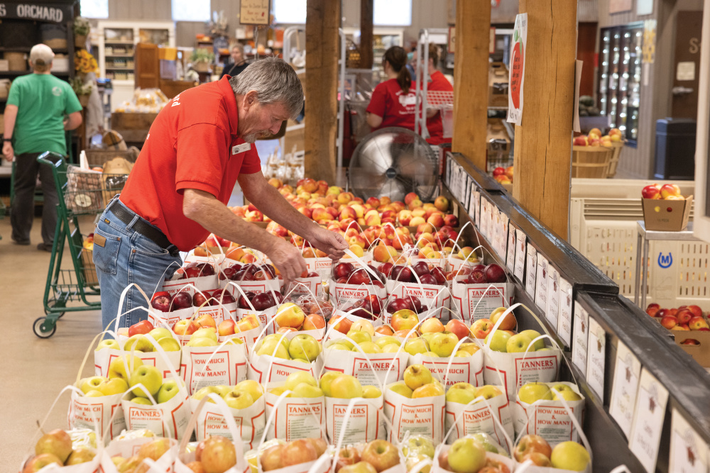Employees stock apples at Tanner's Orchard in Speer, Illinois.