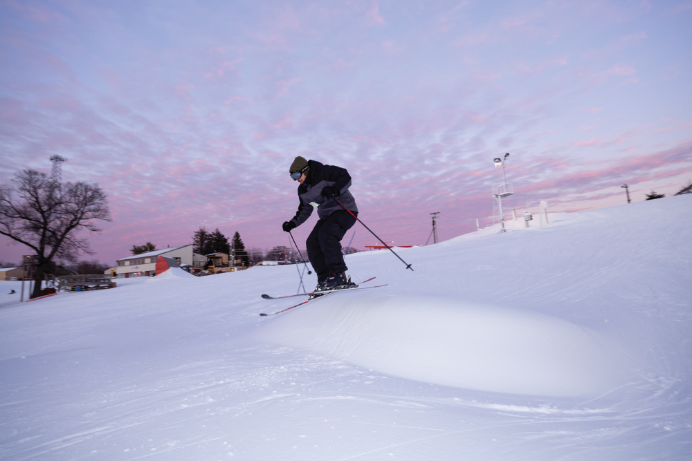 Person skiing on the slopes at Snowstar Winter Sports Park