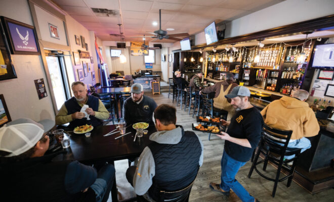 People being served food at Rams Riverhouse