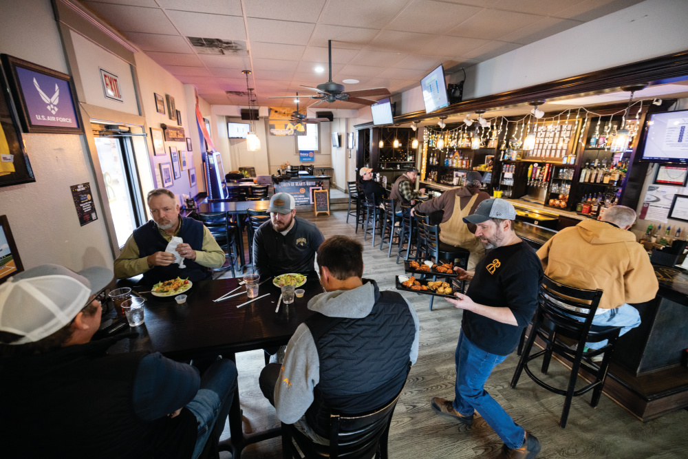 People being served food at Rams Riverhouse