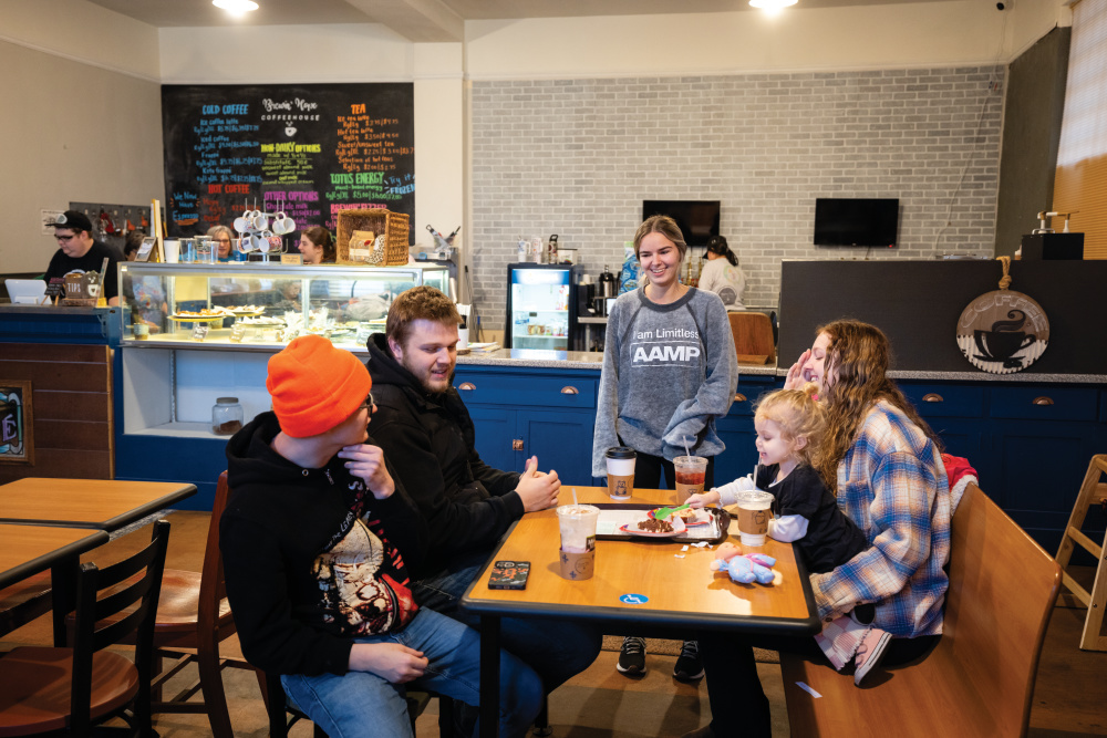 Erica Matthews chats with customers at Brewin' Hope Coffeehouse