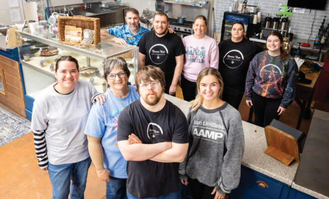 Brewin' Hope Coffee house employees pose for a photo at the coffee shop