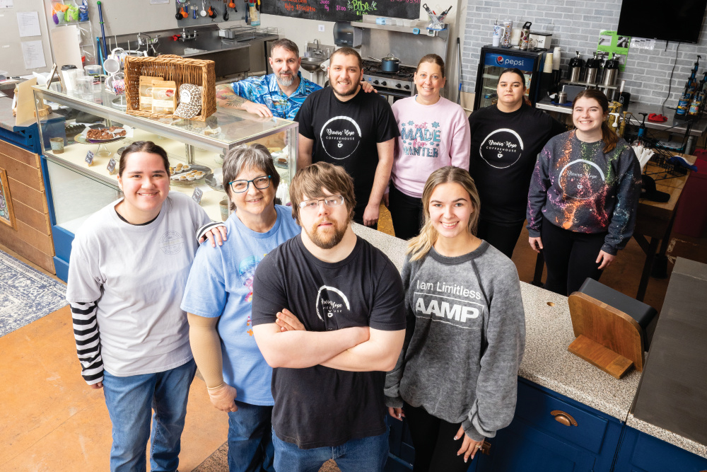 Brewin' Hope Coffee house employees pose for a photo at the coffee shop