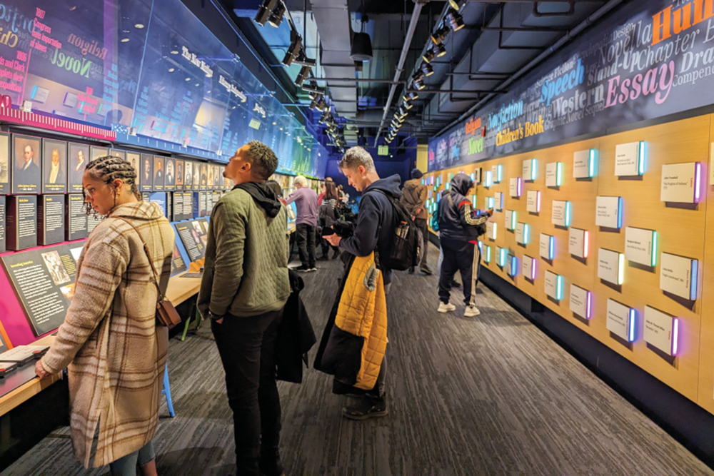 People looking at one of the exhibits at the American Writers Museum