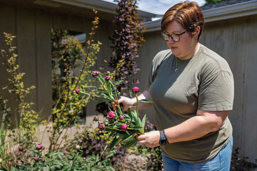 Candice Anderson making a bouquet in the Pollen & Pastry garden