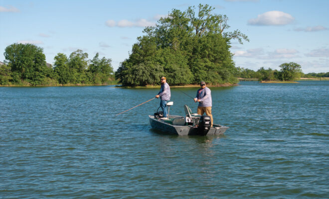 Veterans Adam Newingham and Clayton Yantis fishing on an Illinois lake