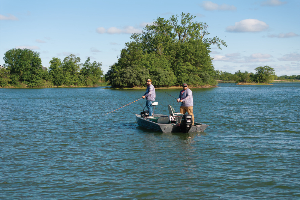 Veterans Adam Newingham and Clayton Yantis fishing on an Illinois lake