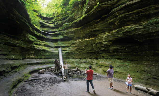 Visitors hiking in Starved Rock State Park, one of the reasons to visit LaSalle County